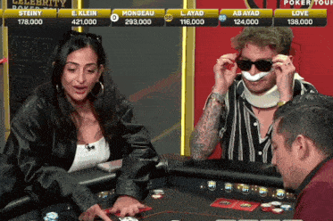 a man wearing sunglasses and a neck brace sits at a poker table next to a woman