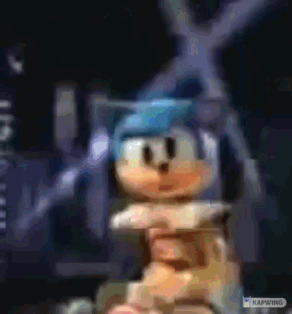 a blurry picture of sonic the hedgehog wearing a blue helmet .
