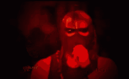 a close up of a man 's face with a red background