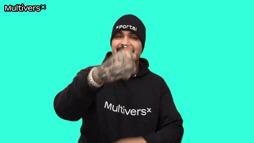 a man giving a thumbs up with the word multivers on his shirt