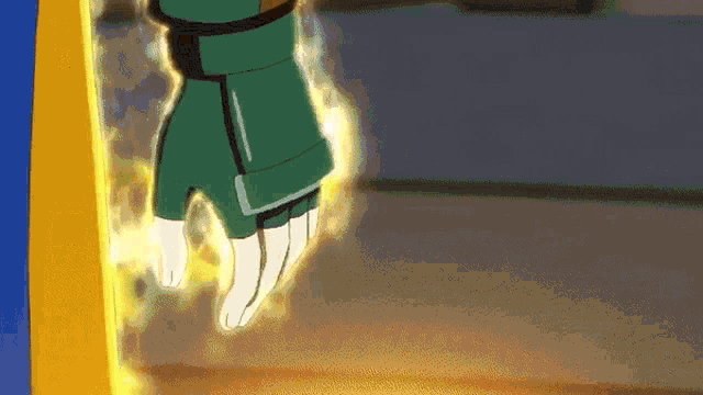 a close up of a person 's hand with a green glove on it