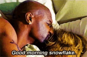 a man kissing another man in bed with the words " good morning snowflake " on the bottom