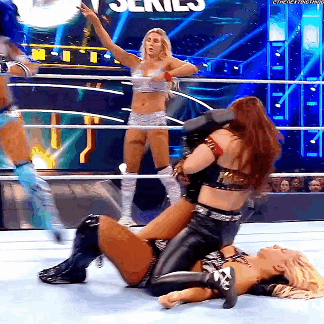 a woman in a wrestling ring with the word series on the ring