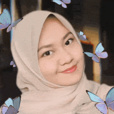 a woman wearing a hijab with butterflies flying around her