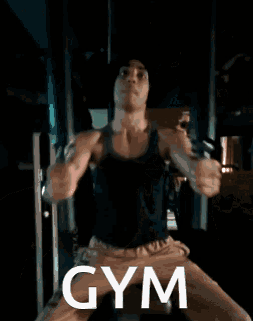 a woman is wearing a tank top that says gym
