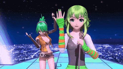 a girl with green hair is singing into a microphone while another girl stands behind her