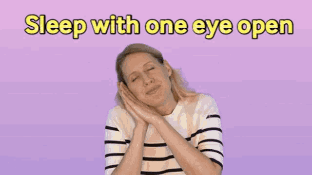 a woman with her eyes closed and the words sleep with one eye open behind her