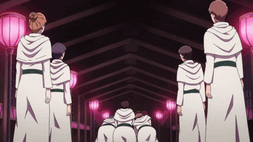 a group of people in white robes are standing in a tunnel