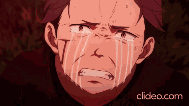 a close up of a man 's face with tears coming out of his eyes