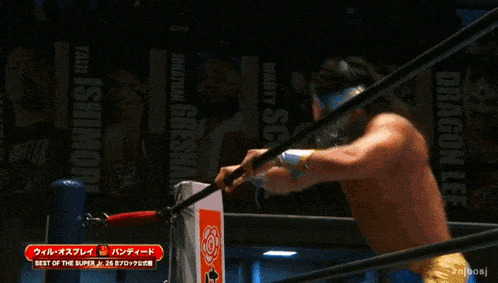 a blurred image of a wrestling match with the words best of the super jr. on the bottom right