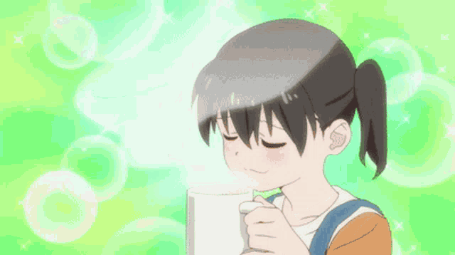 a girl with her eyes closed is drinking from a white cup