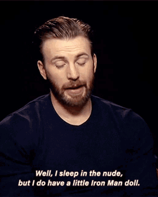 a man wearing a watch says well i sleep in the nude but i do have a little iron man doll .