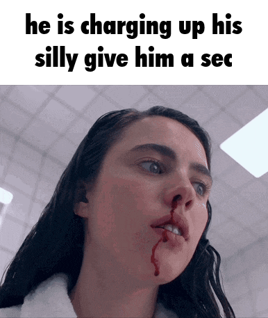 a woman with blood coming out of her nose has a caption that says he is charging up his silly give him a sec