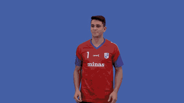 a man in a red and purple minas jersey