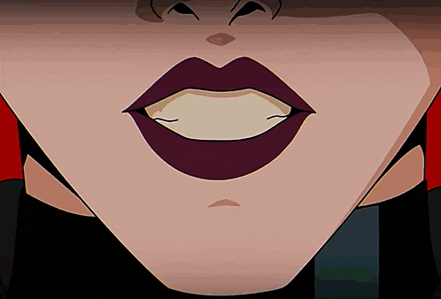a close up of a woman 's mouth with dark lips