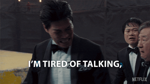 a man in a tuxedo is tired of talking
