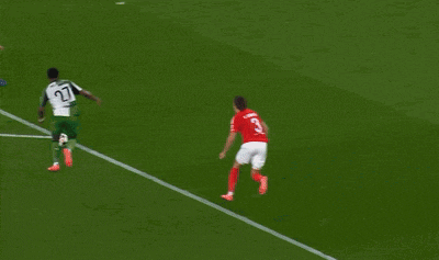 a soccer goalie catches a soccer ball in front of a banner that says mastercard