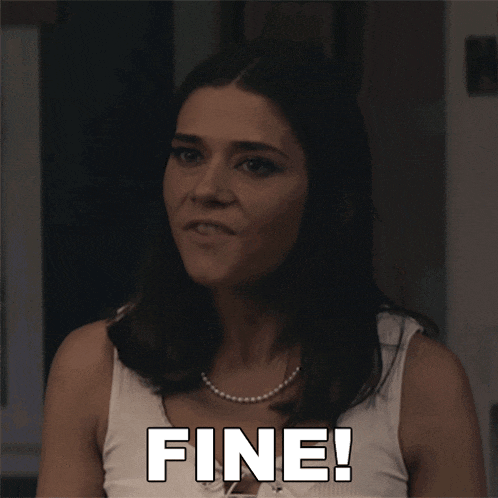 a woman in a white tank top with the word fine written on it
