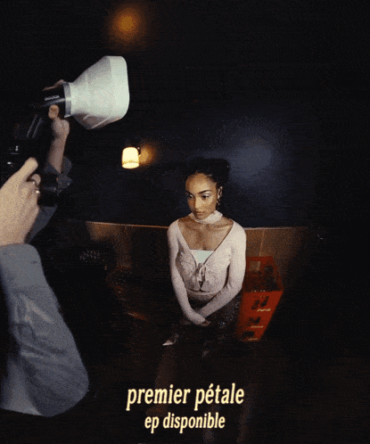 a man taking a picture of a woman with the words premier petale ep disponible