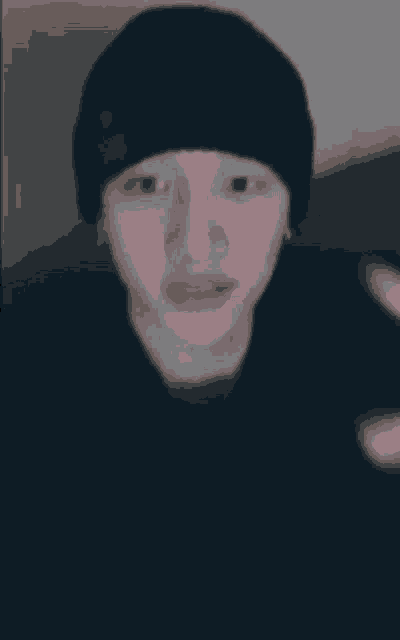 a close up of a person 's face with their tongue sticking out .
