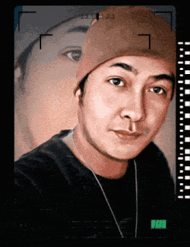 a man wearing a beanie and a necklace takes a selfie with a camera that says 3.2.1.2.3