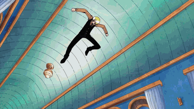 a man is flying through the air in a room with a blue ceiling