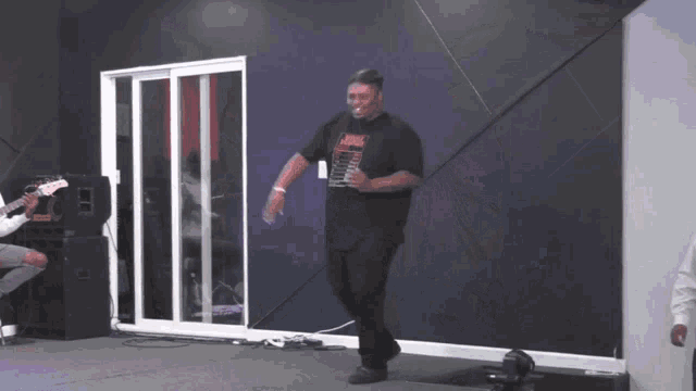 a man wearing a shirt that says jesus is dancing
