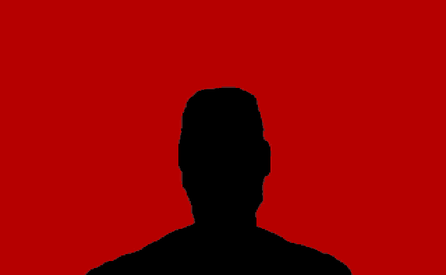 a black silhouette of a man 's head on a red background