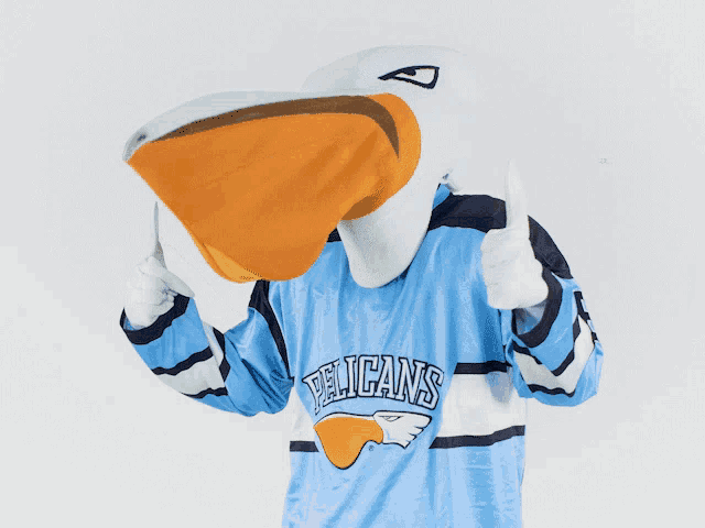 a pelican mascot is wearing a pelicans jersey and giving a thumbs up