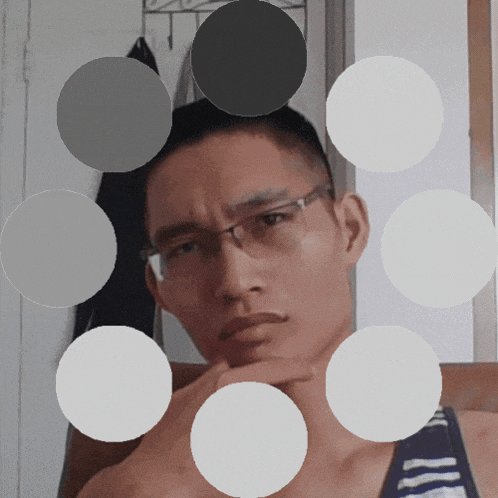 a man wearing glasses is surrounded by circles of different sizes