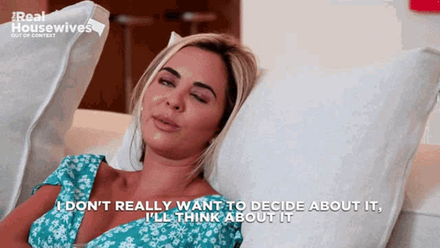 a woman laying on a couch with the words " i don 't really want to decide about it "