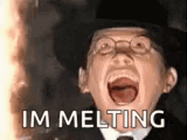 a statue of a man in a top hat and glasses is screaming .