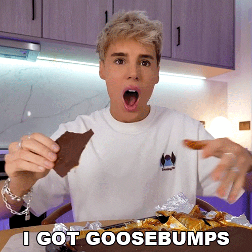 a man eating a piece of chocolate with the words " i got goosebumps " written below him