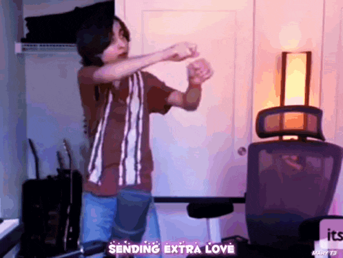 a person is dancing in a room with the words " sending extra love " on the bottom