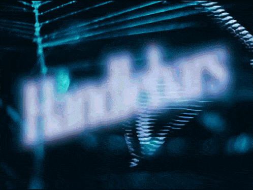 a blurred image of the word hunters on a blue background