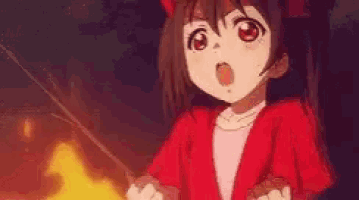 a girl in a red jacket is holding a fishing rod in her hands .