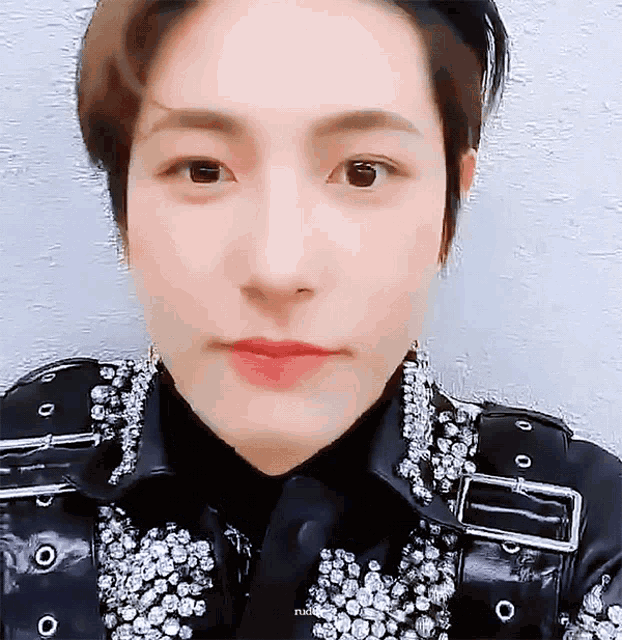 a close up of a person 's face with the word nct on the bottom right corner