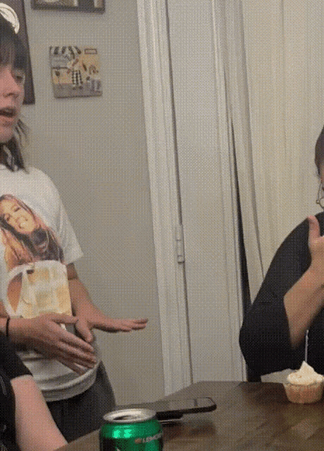 a woman wearing a t-shirt with a picture of a girl on it