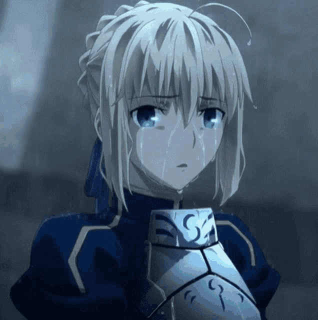 a girl with blonde hair and blue eyes is crying while wearing armor .
