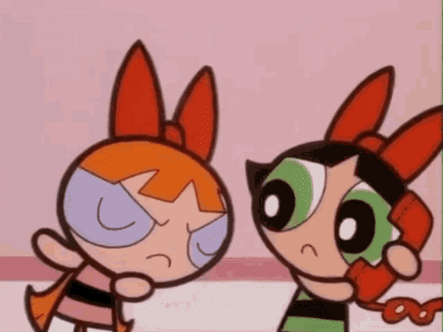 blossom and buttercup from the powerpuff girls are talking on a phone .