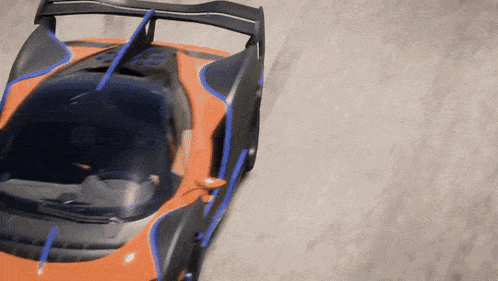 an orange and black sports car with blue stripes on the side