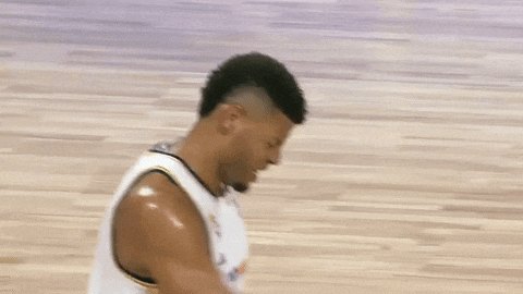 a basketball player wearing a white jersey that says ' 4v4 ' on it