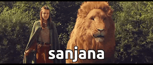 a woman in a green cape is standing next to a lion with the name sanjana written on the bottom
