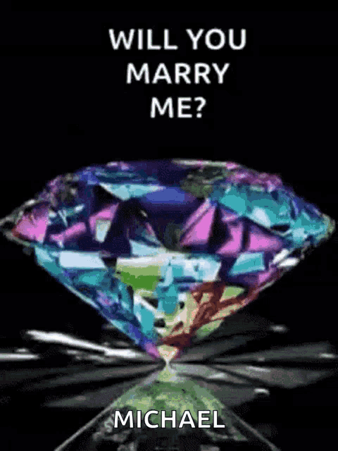a rainbow colored diamond with the words will you marry me