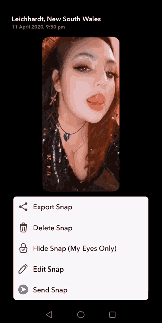 a picture of a woman with her tongue hanging out is displayed on a phone screen