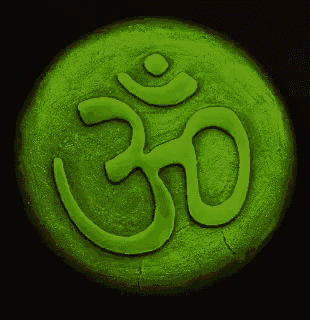 a gold coin with a symbol on it that says om