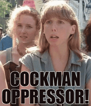 two women are standing in front of a sign that says cockman oppressor !