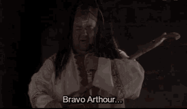 a man with long hair and a beard says bravo arthur