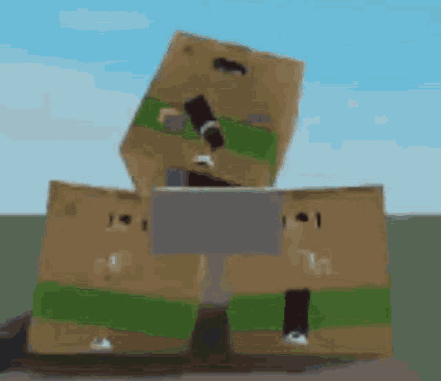 a stack of cardboard boxes sitting on top of each other on a table .