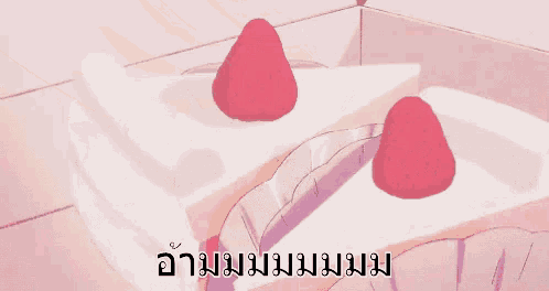 two slices of cake with strawberries on top are being taken out of a box ..